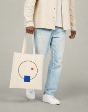 Quiet Orbit design on a natural canvas tote
