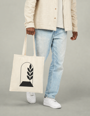 The Everyday Canvas Tote carried in a clean neutral setting