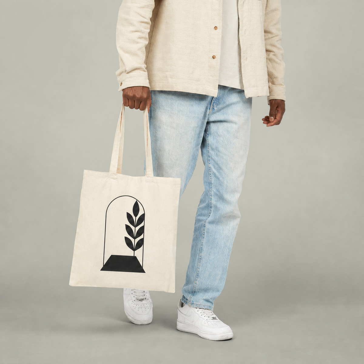 The Everyday Canvas Tote carried in a clean neutral setting
